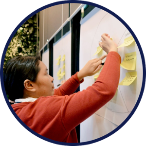 child writing on board